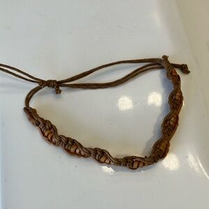 Leather light and dark brown braided 5 1/2” adjustable bracelet.
